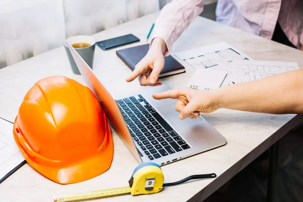 People planning a residential electrical project at a table