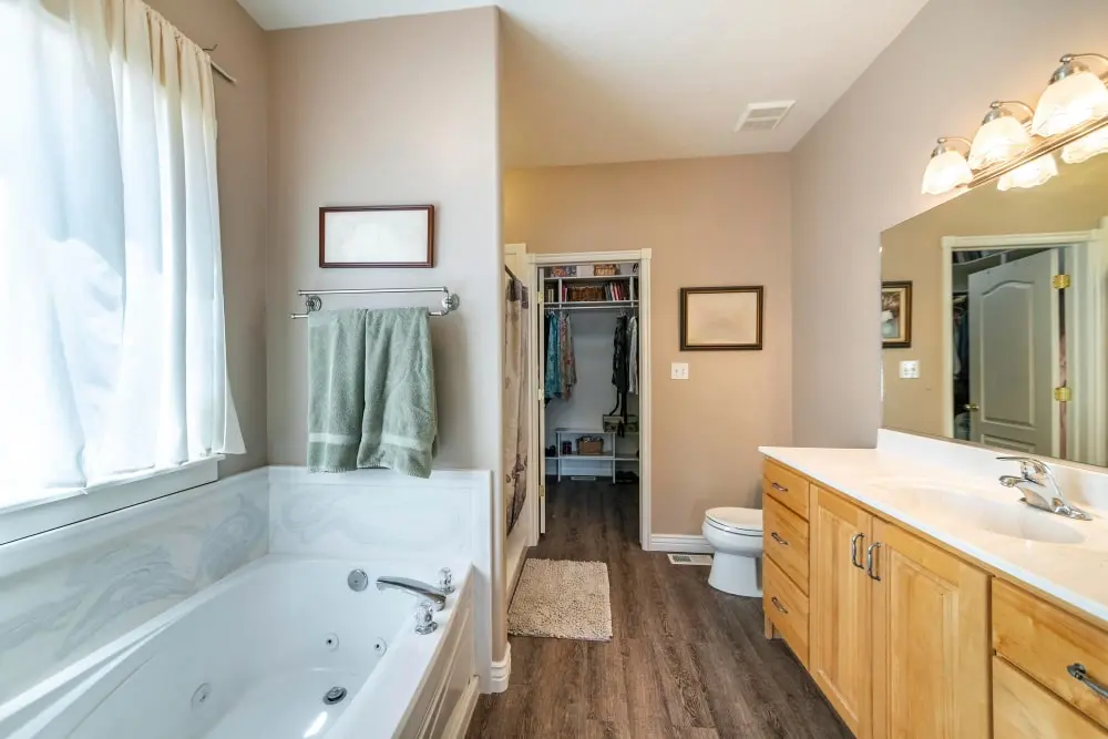 Bathroom layout showing a bath, vanity basin and the surrounding finished surfaces
